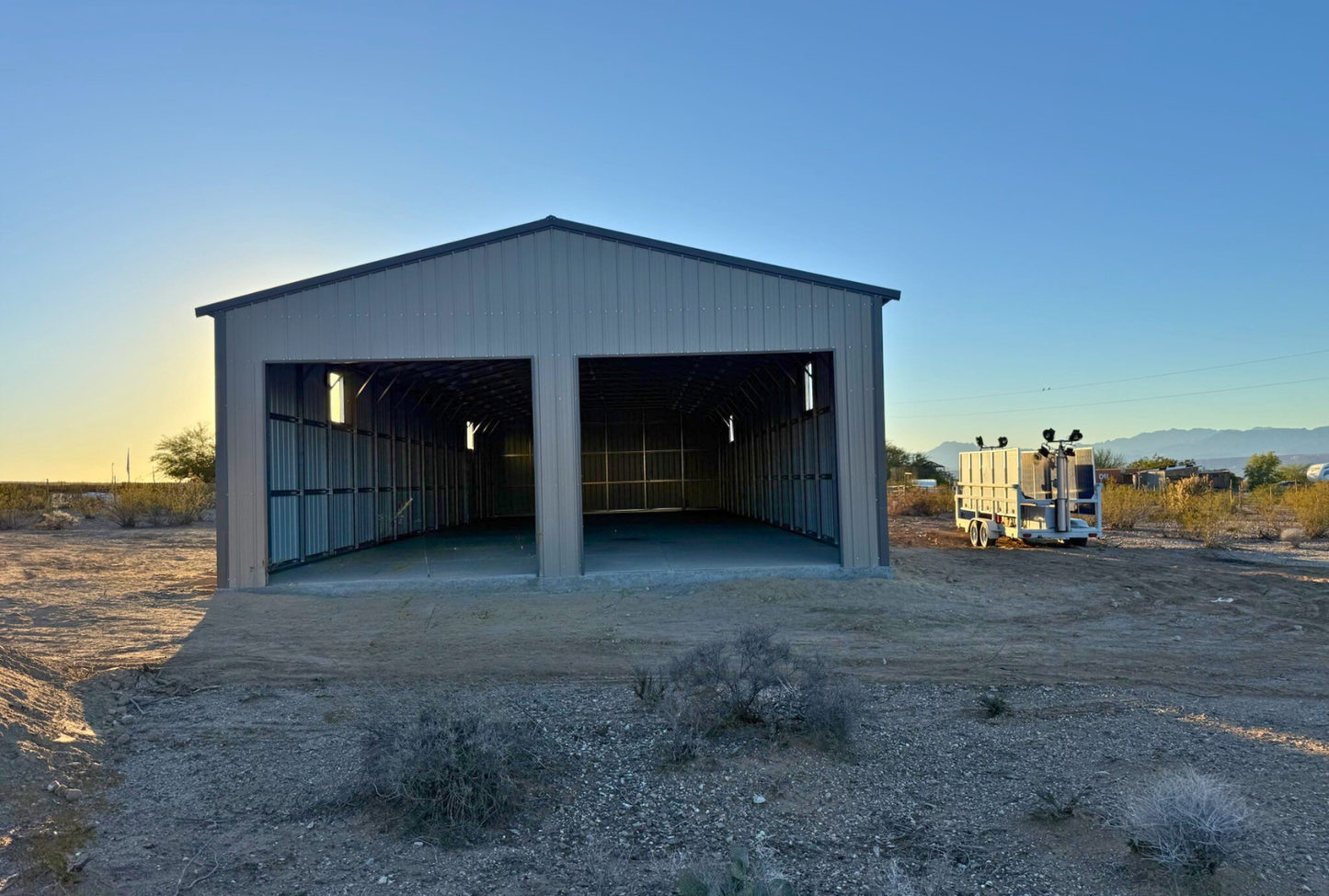Front view of a 30x80 A-frame metal building by Alpha Steel Buildings, featuring two 12x11 overhead door frame outs — ideal steel garage or workshop design.
